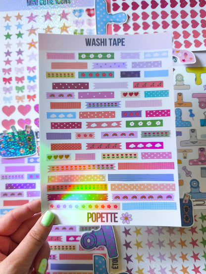 Washi tape sticker sheet held by hand, featuring colorful patterned tape strips