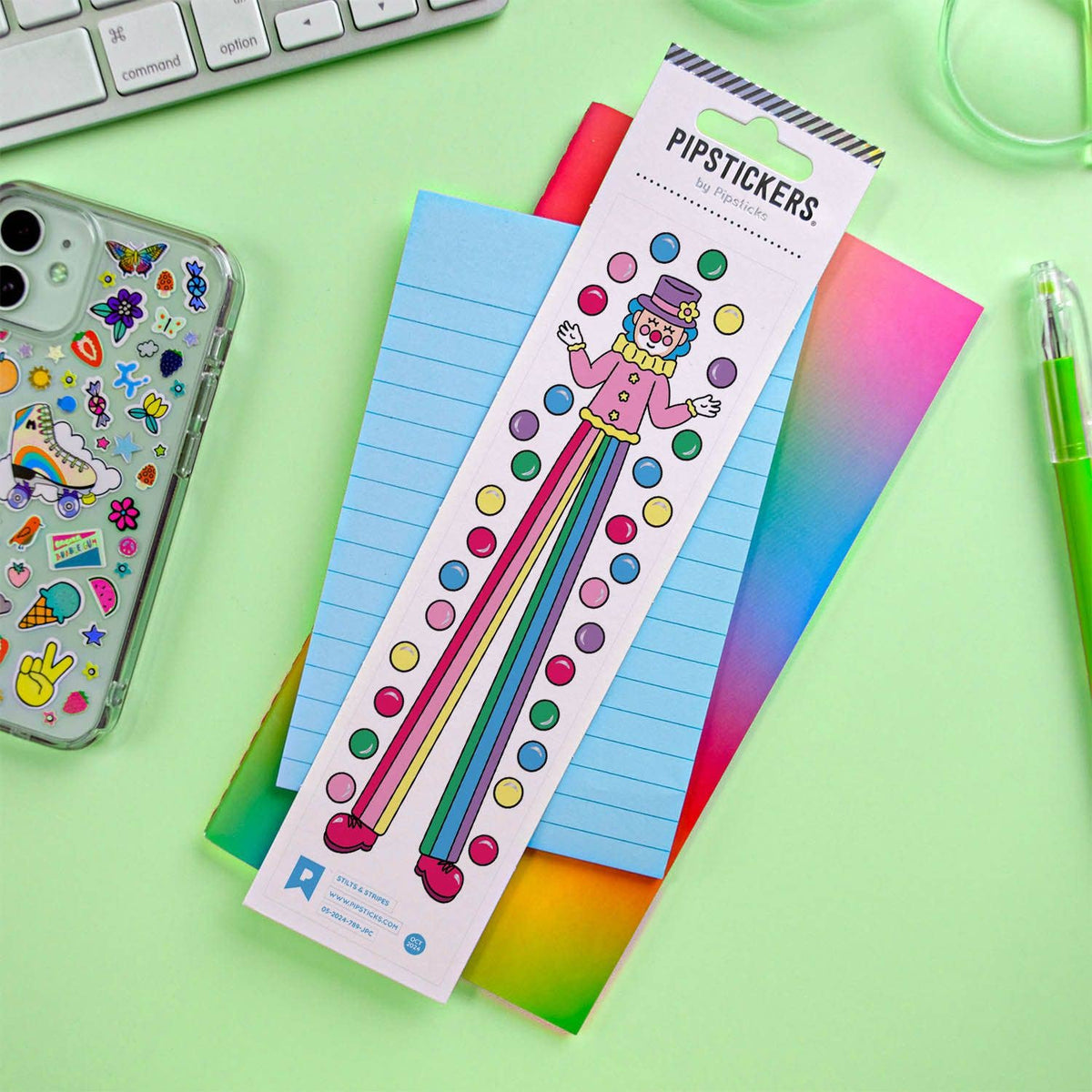 Sticker sheet featuring cartoon striped character with multicolor dots, on blue notebook