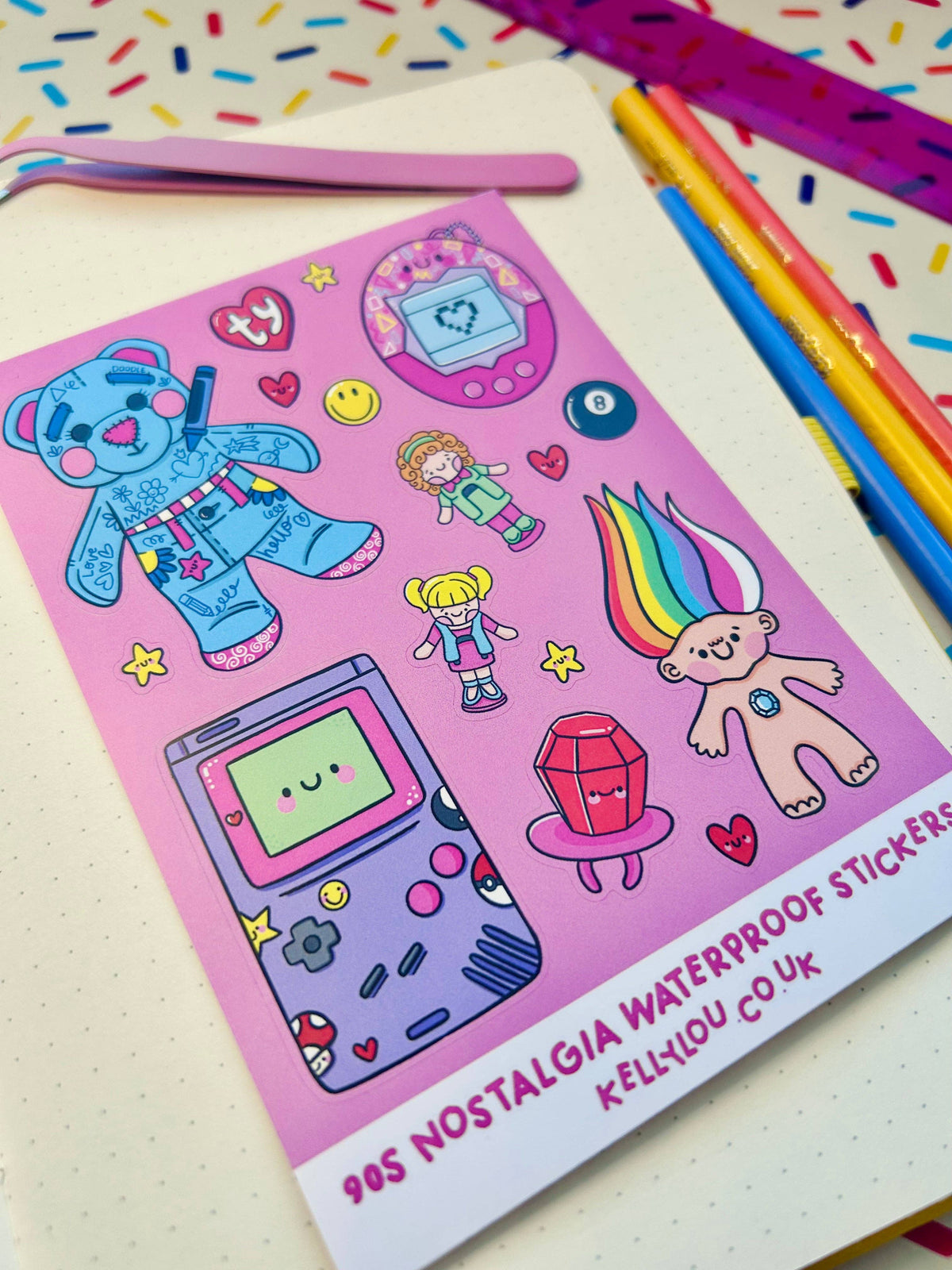 Vinyl sticker sheet with cute 90s characters, game devices, and rainbow-bunny design