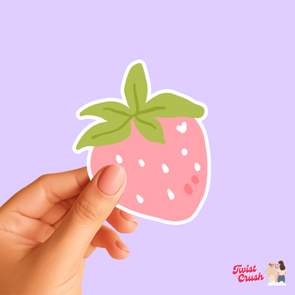 Strawberry-themed vinyl sticker held by a hand, pink fruit with green leaves