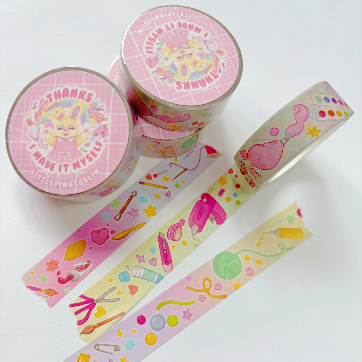 Colorful washi tape rolls and strips with pastel stationery hearts pattern