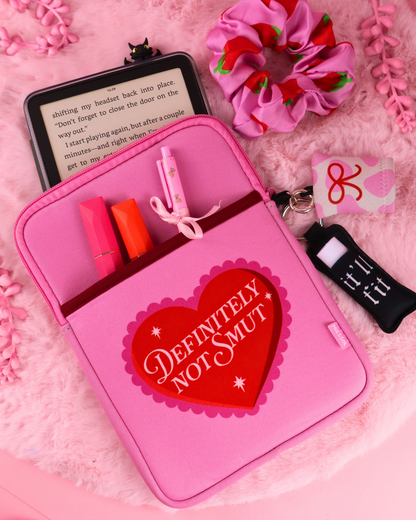 Definitely Not Smut e-reader sleeve with compartments, pink, heart logo front