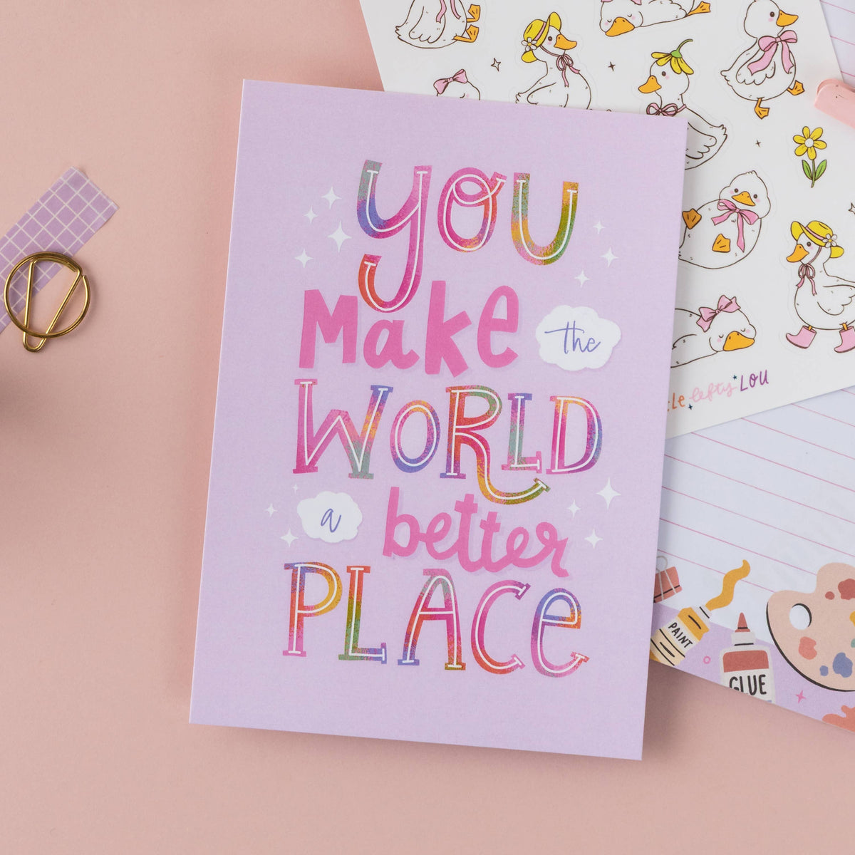 Purple postcard with colorful lettering: 'You make the world a better place'