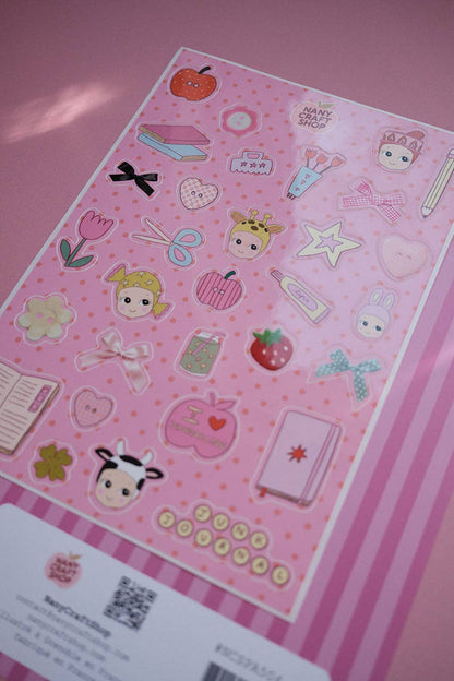 Pink sticker sheet with characters, strawberries, hearts, and colorful outline icons