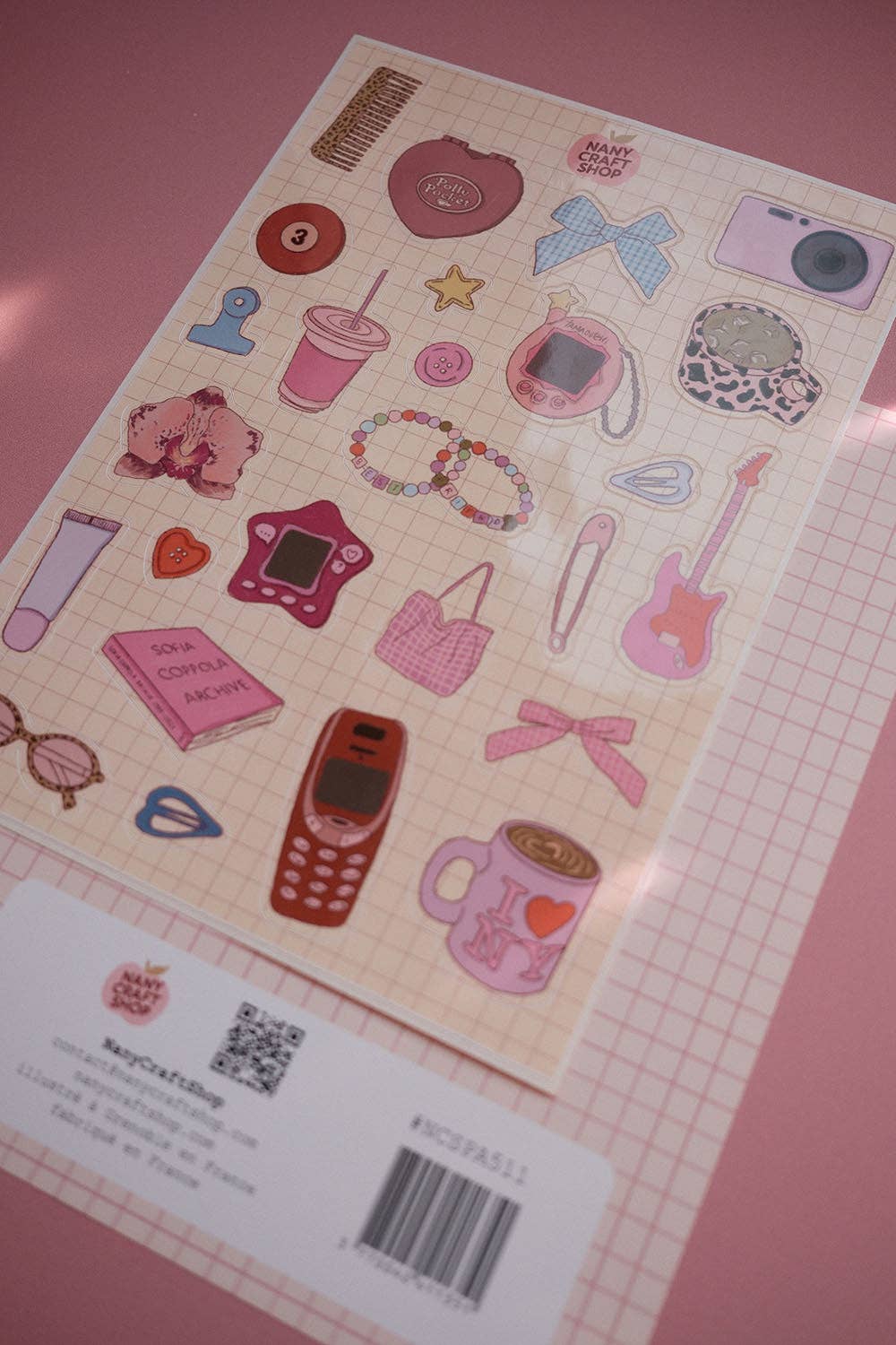A5 sticker sheet with mixed retro stickers: camera, heart, guitar, bottles, cards, beads