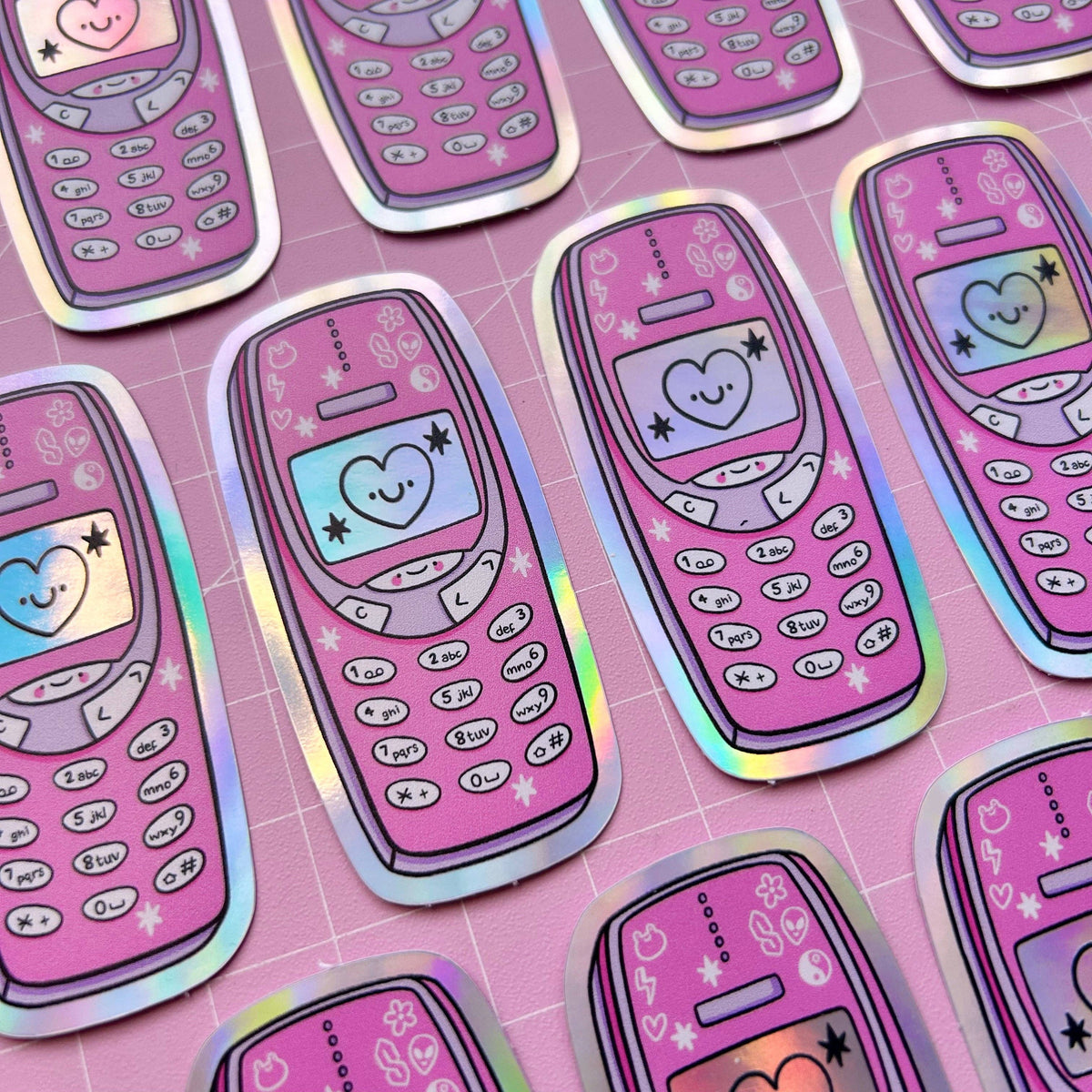 Sheet of holographic stickers with pink phone designs, hearts, and smiley face