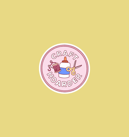 Round holographic craft hoarder sticker, pink badge with scissors, yarn, and text