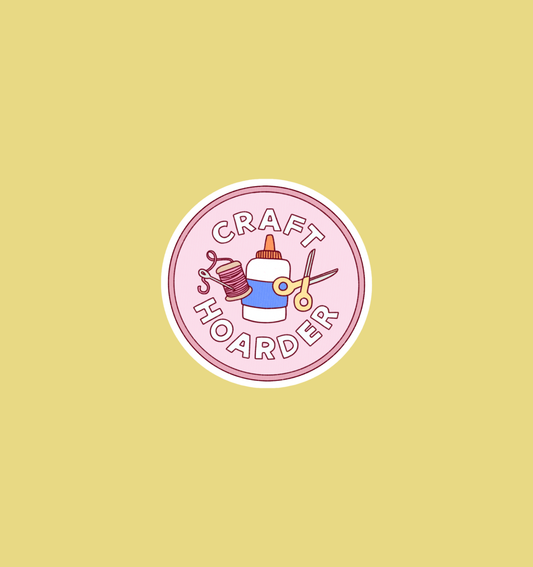 Round holographic craft hoarder sticker, pink badge with scissors, yarn, and text