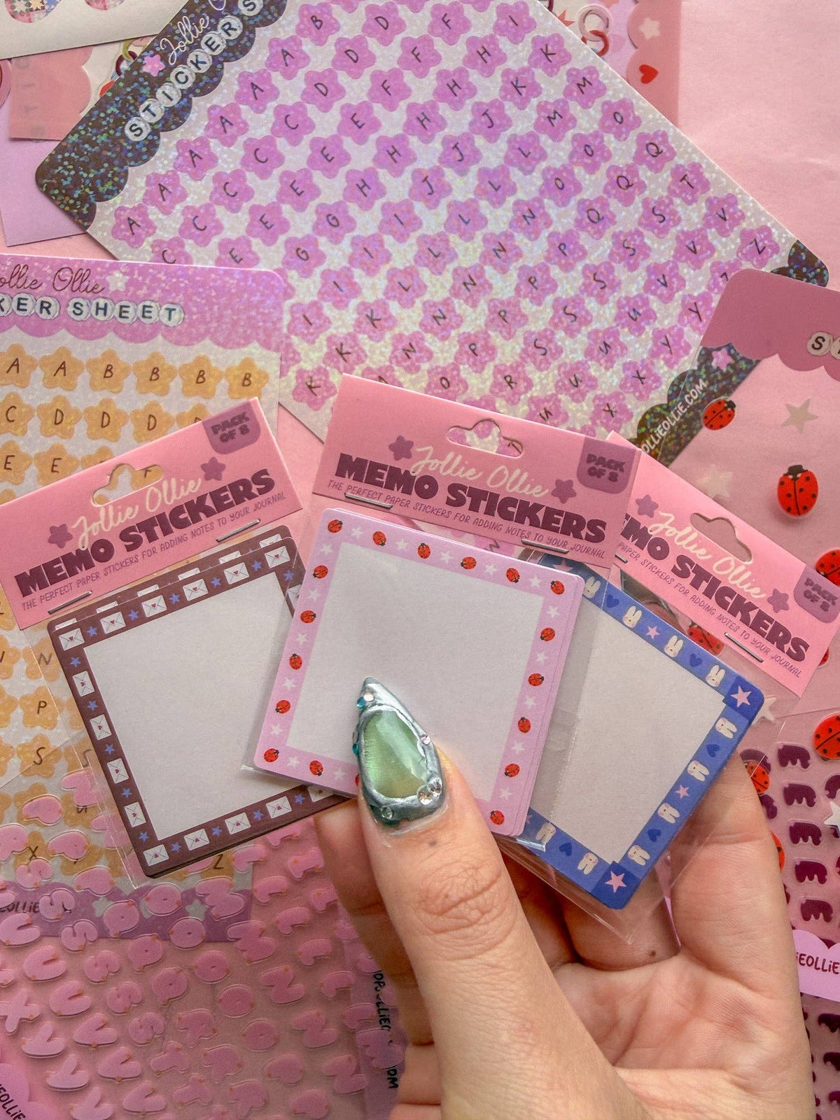Memo sticker pack in hand, multiple bordered memo sticker sheets