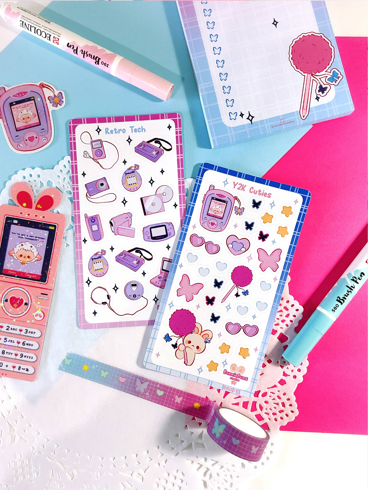 Sticker sheet with retro tech icons, pastel devices, hearts, bows, and flowers
