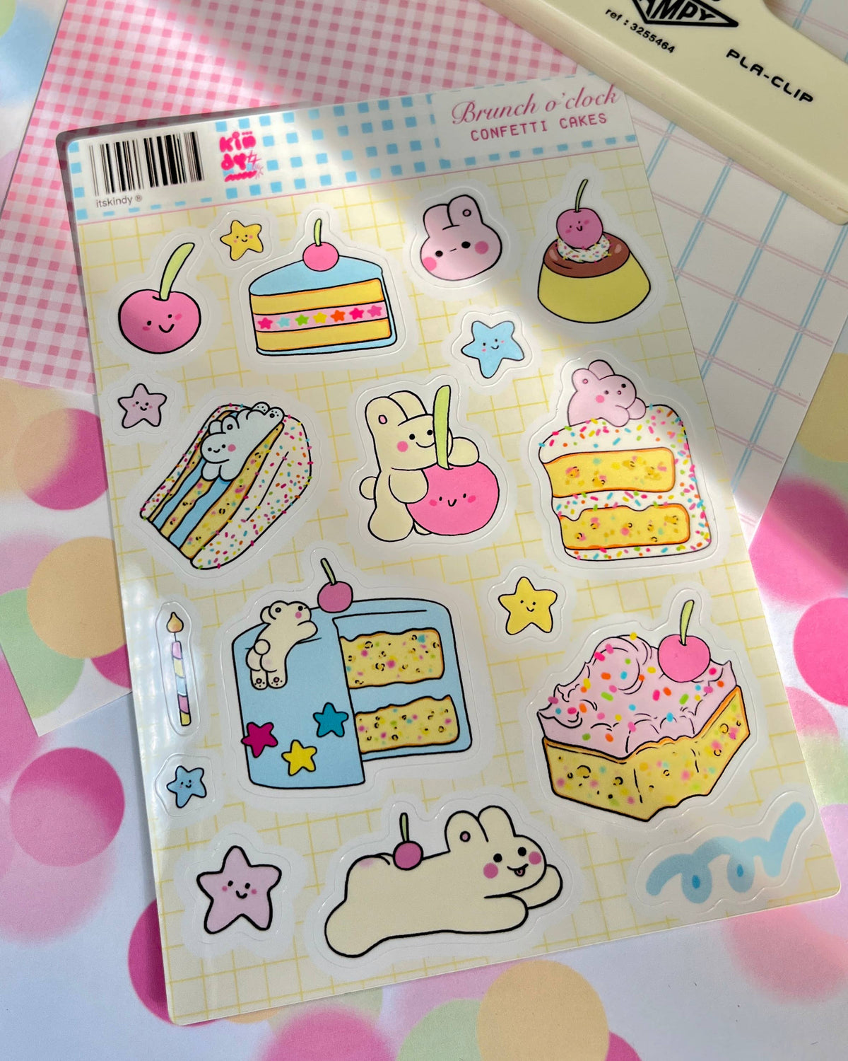 Sticker sheet featuring rabbits, layer cakes, cupcakes, and star decorations