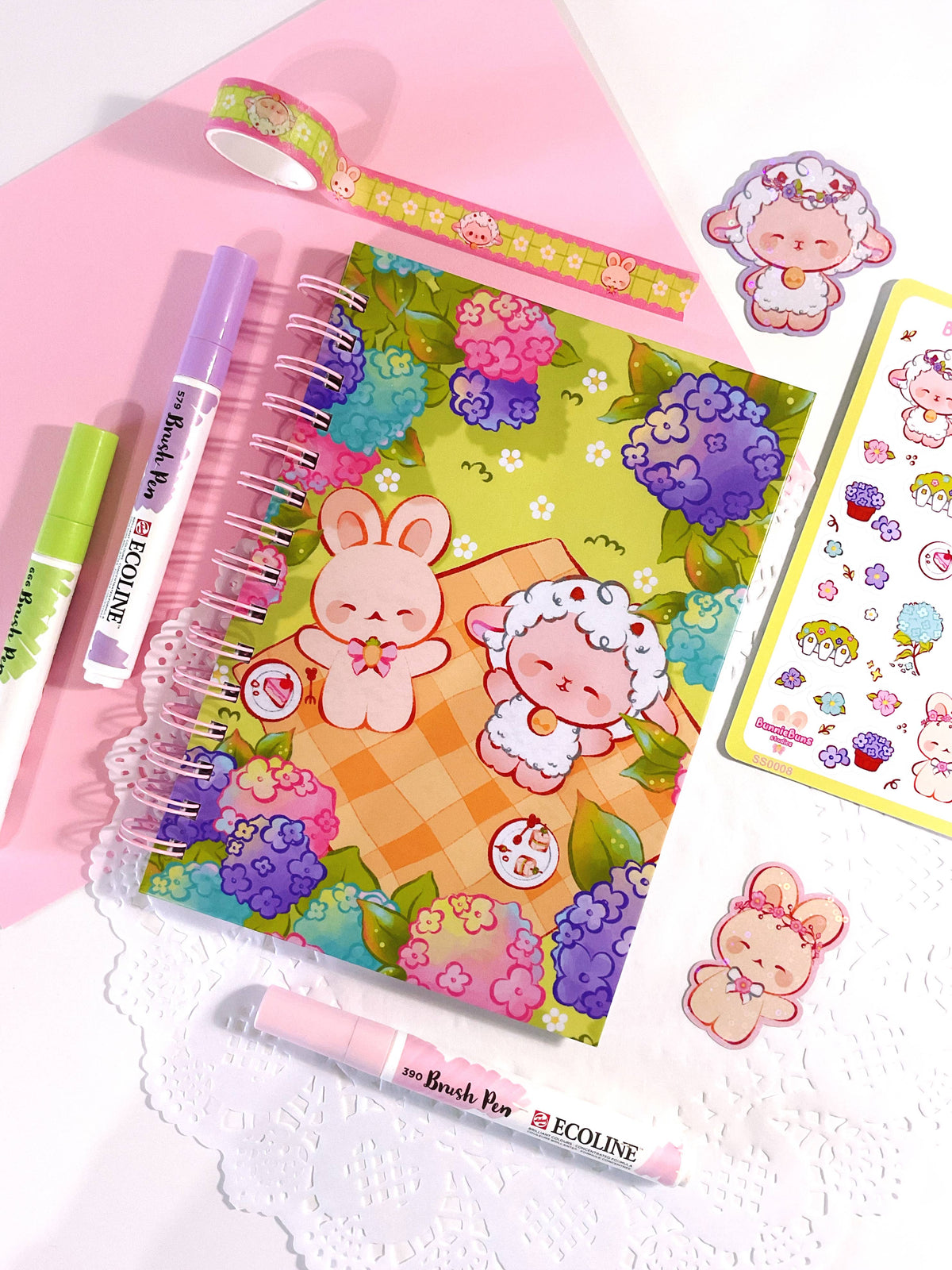 Cute pink spiral notebook with colorful floral bunny cover and stickers