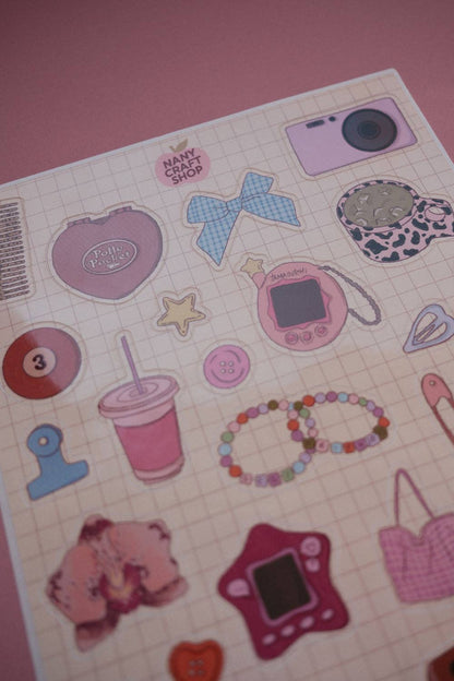 A5 sticker sheet close-up with camera, star, phone, heart and pink accessories