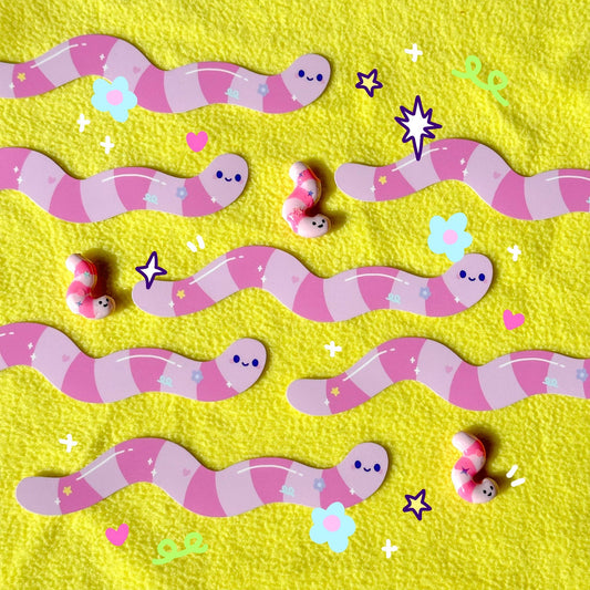 Long Wormie sticker sheet with purple-pink smiling worm characters and stars