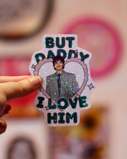 Heart-shaped holographic sticker with man portrait and text BUT DADDY LOVE HIM