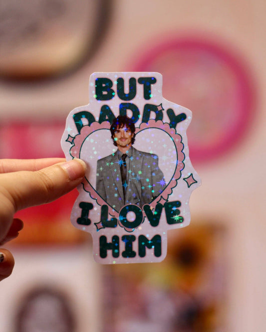Heart-shaped holographic sticker with man portrait and text BUT DADDY LOVE HIM