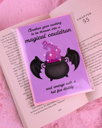 Purple birthday card with black cauldron, bat wings, and “hot fae daddy” message.