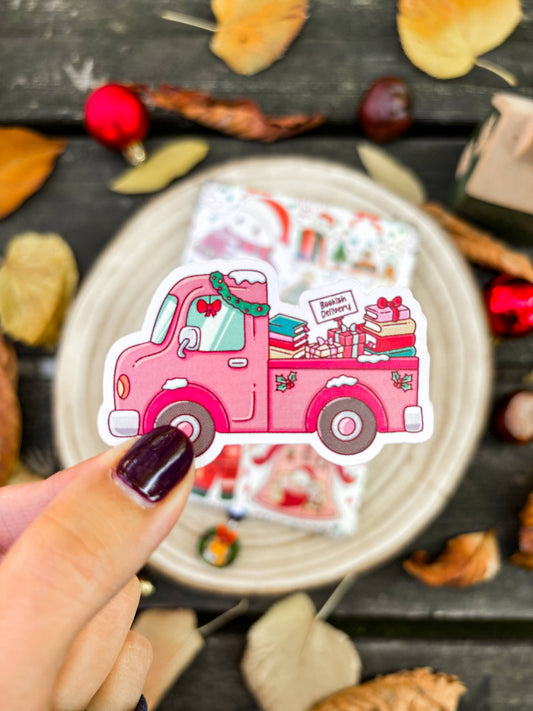 Pink holiday delivery truck vinyl sticker with bookish characters