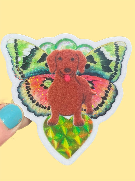 Butterfly dachshund sticker with orange dog and iridescent green-yellow multicolor wings