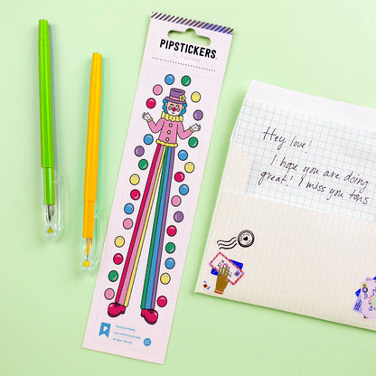 Sticker sheet with cartoon striped character and multicolor dots, with rainbow stripes