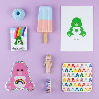 Pink care bear rainbow glitter sticker, flat lay view with sparkly border