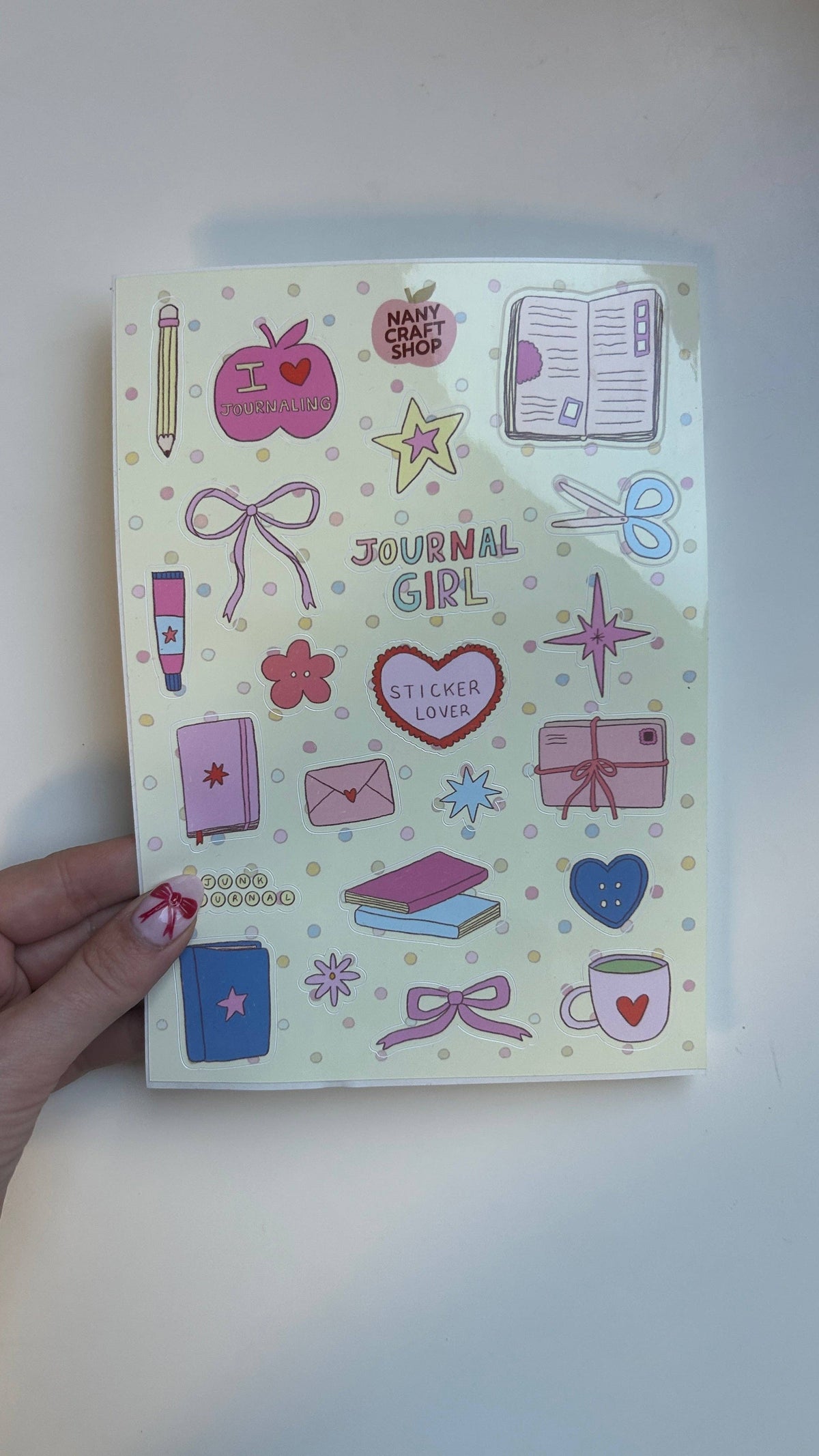 A5 sticker sheet with stationery and love-themed icons in pink and blue tones