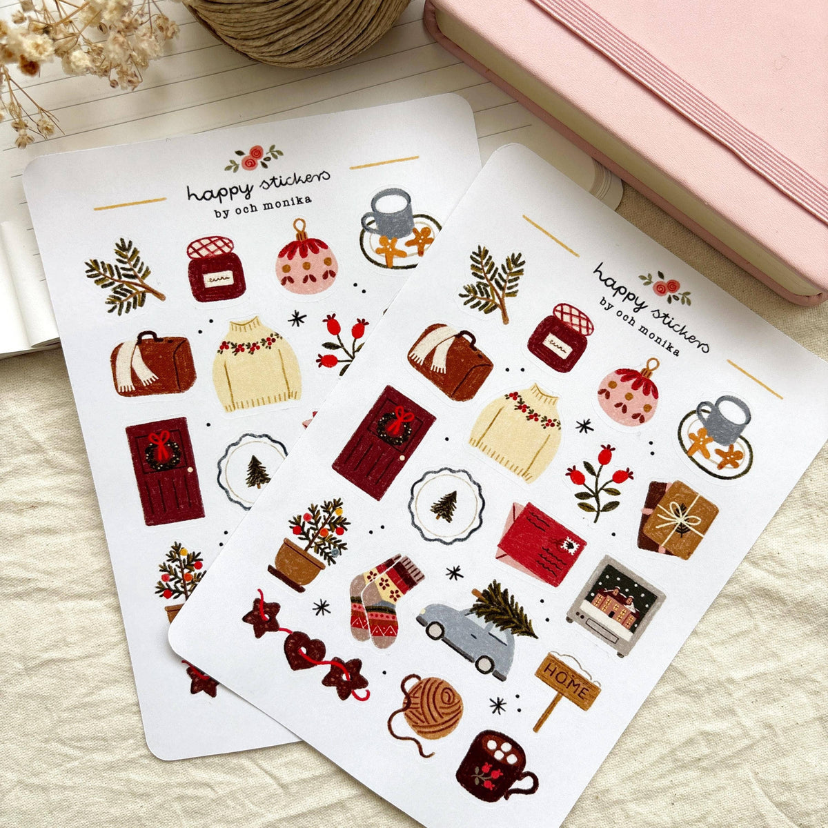 Winter sticker sheets with coffee mugs, gift boxes, ornaments, and a small home sign.