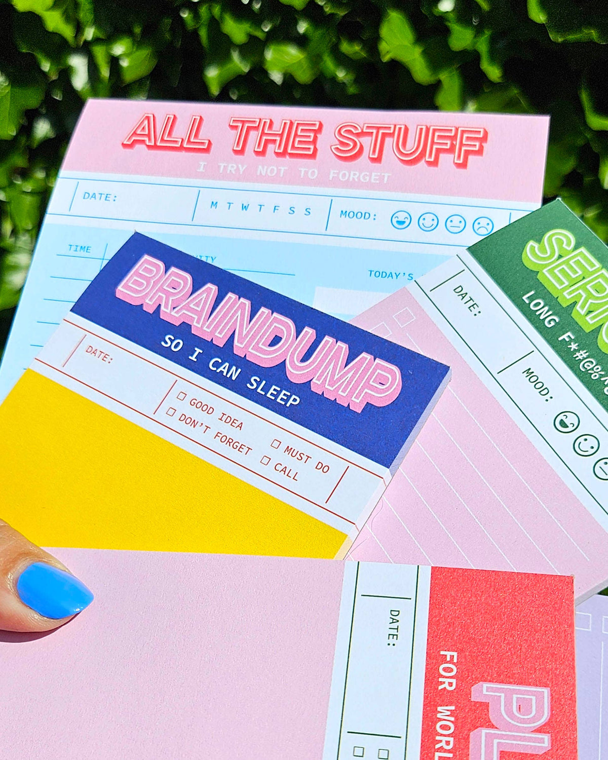 Overlapping A6 notepads with bold 'Brain dump' and 'All the stuff' headings
