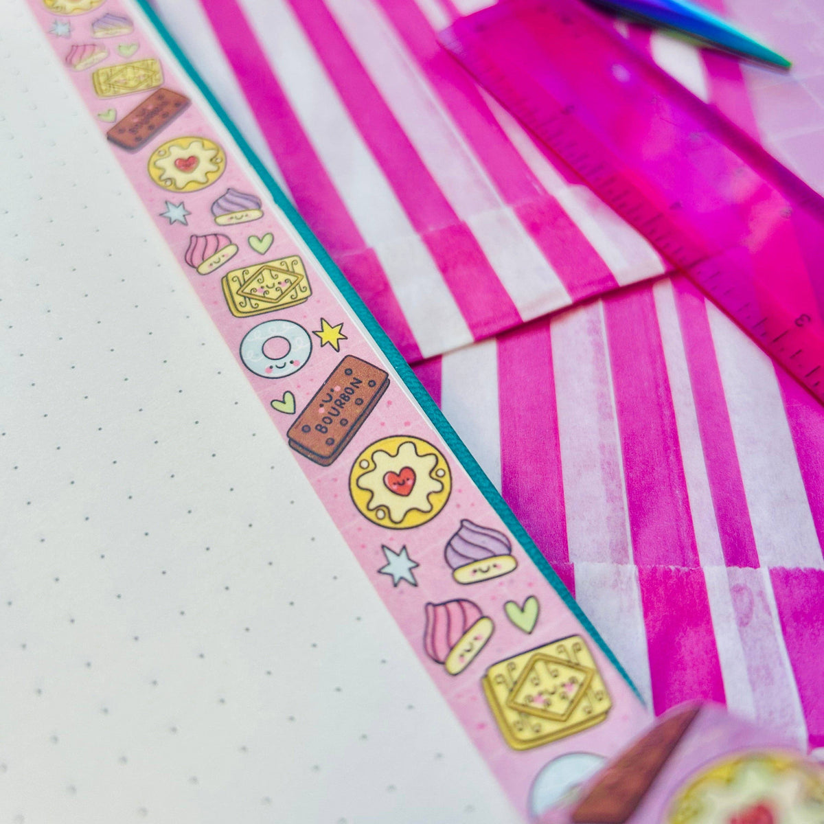 Pastel vertical washi tape strip with biscuit and heart icons on striped paper