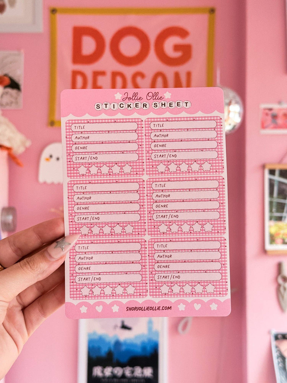 Pink sticker sheet with title and author lines, start/end boxes, and decorative icons
