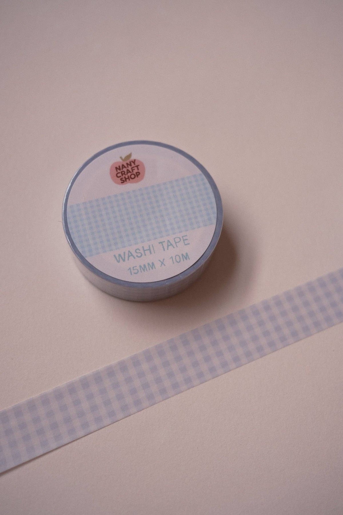 Blue check gingham washi tape roll with printed label on tabletop, 15mm x 10m.