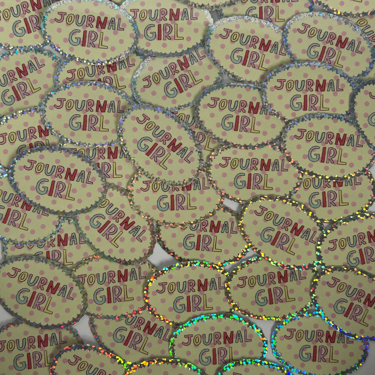 Sheet of oval “JOURNAL GIRL” stickers with speckled, glittery edges.