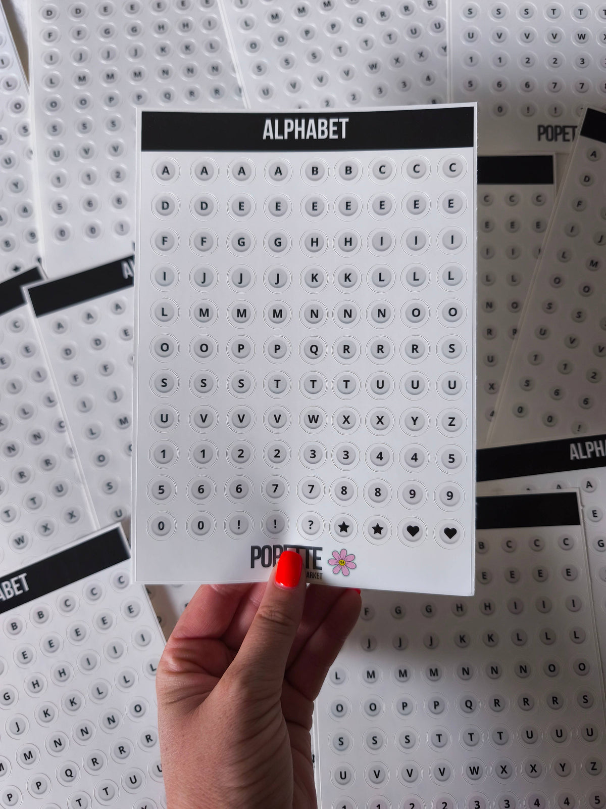 Pearl alphabet sticker sheet with A–Z letters, punctuation, hearts and stars; POPETTE