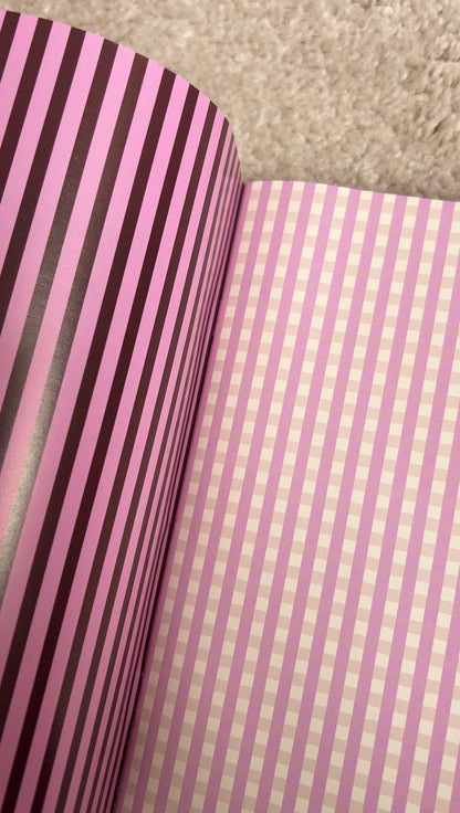Scrapbook paper spread, dark purple vertical stripes and pale pink grid page