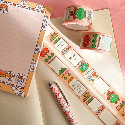 Washi tape roll and strips with colorful animals, hearts, and label boxes