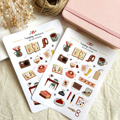Two cozy journaling sticker sheets featuring coffee cups, books and camera icons