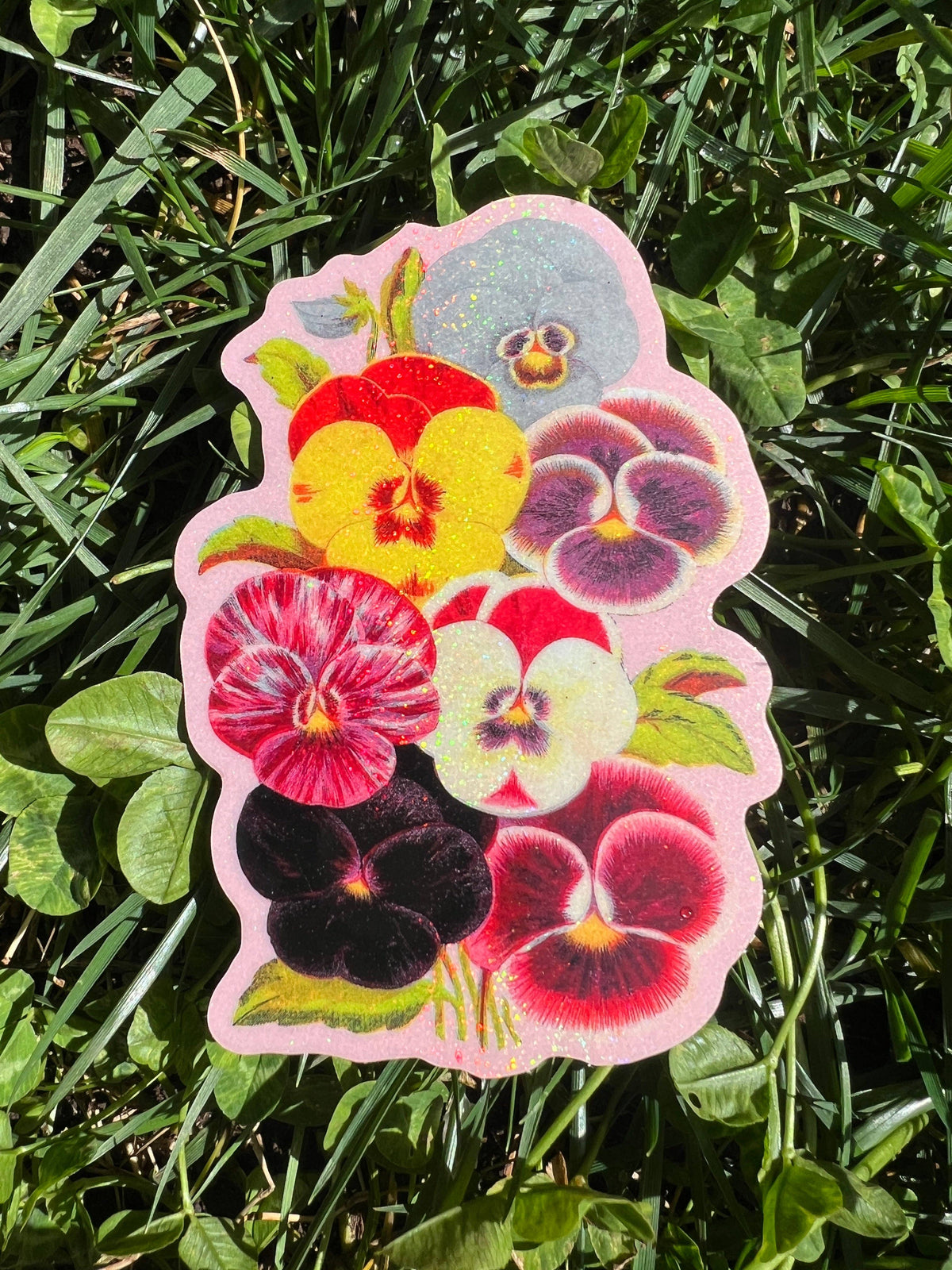 4 inch floral sticker with colorful violets and sparkly glitter border
