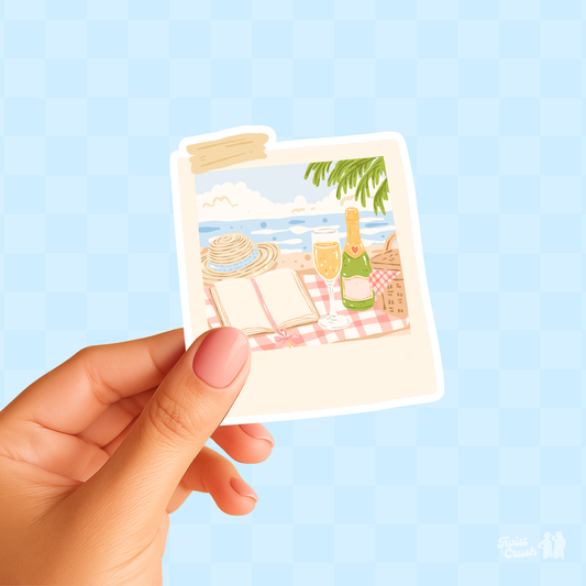 Polaroid-style beach sticker with hat, bottle, chair, and palm trees in pastel colors