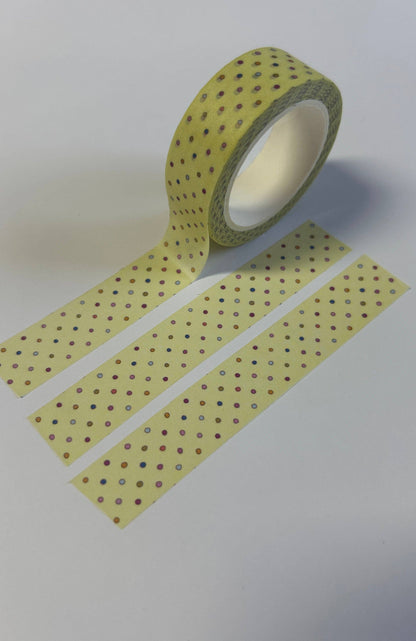 Washi tape spool with yellow tape and dark polka-dot pattern