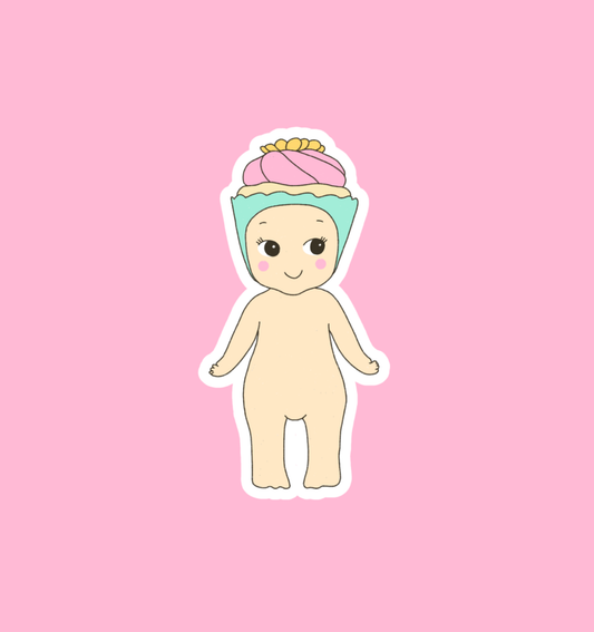 Baby cupcake character sticker with pink hat, pastel face, and beige body.