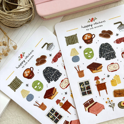 Bedtime sticker sheets close-up with pajamas, teapot, nightstand, and slippers