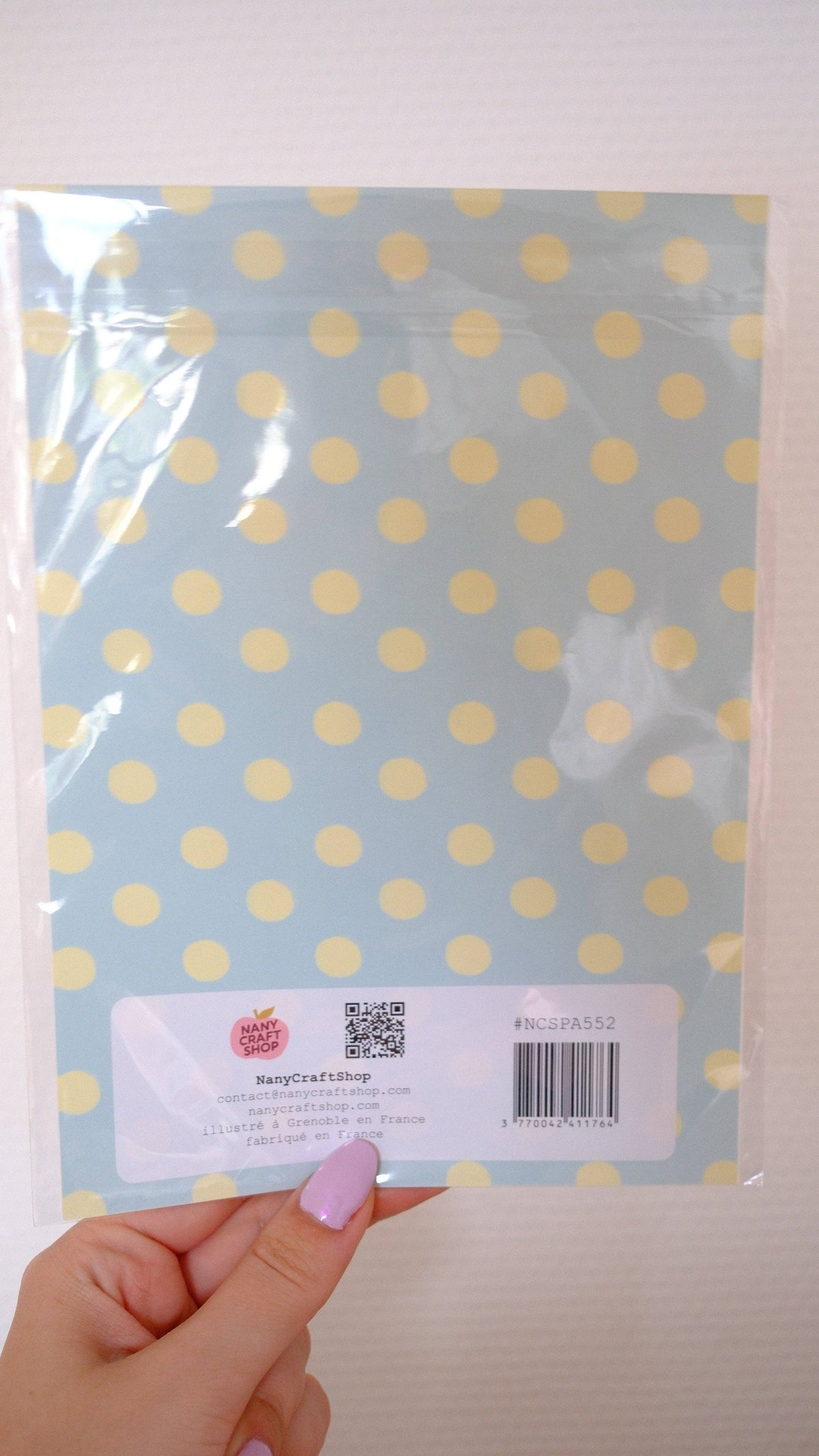 Back of an A5 sticker sheet with barcode label and printed product information