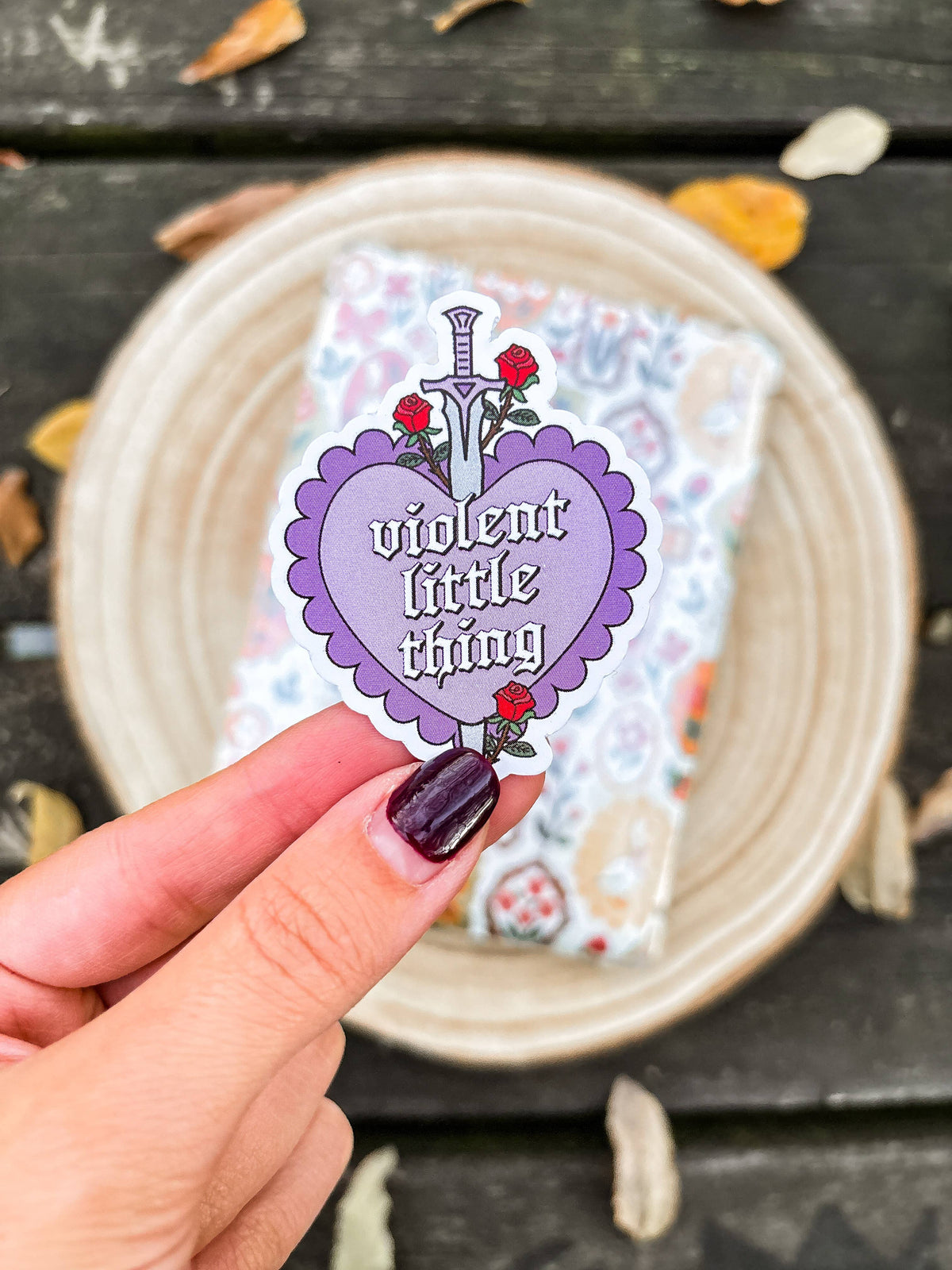 Purple heart vinyl sticker with roses and 'violent little thiny' text