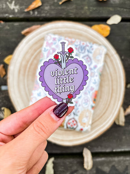 Purple heart vinyl sticker with roses and 'violent little thiny' text