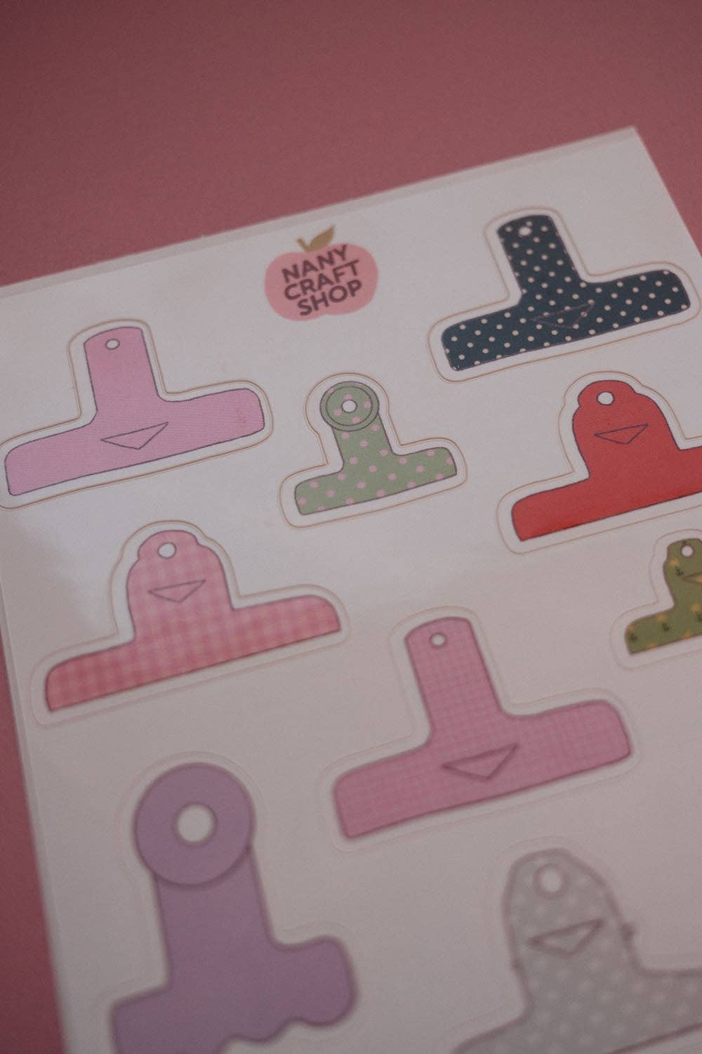Board clamps sticker sheet close-up of colorful T-shaped clamp pieces