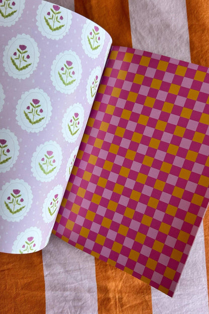 A5 scrapbook paper sheet with lilac leaf medallions and orange purple checkered pattern