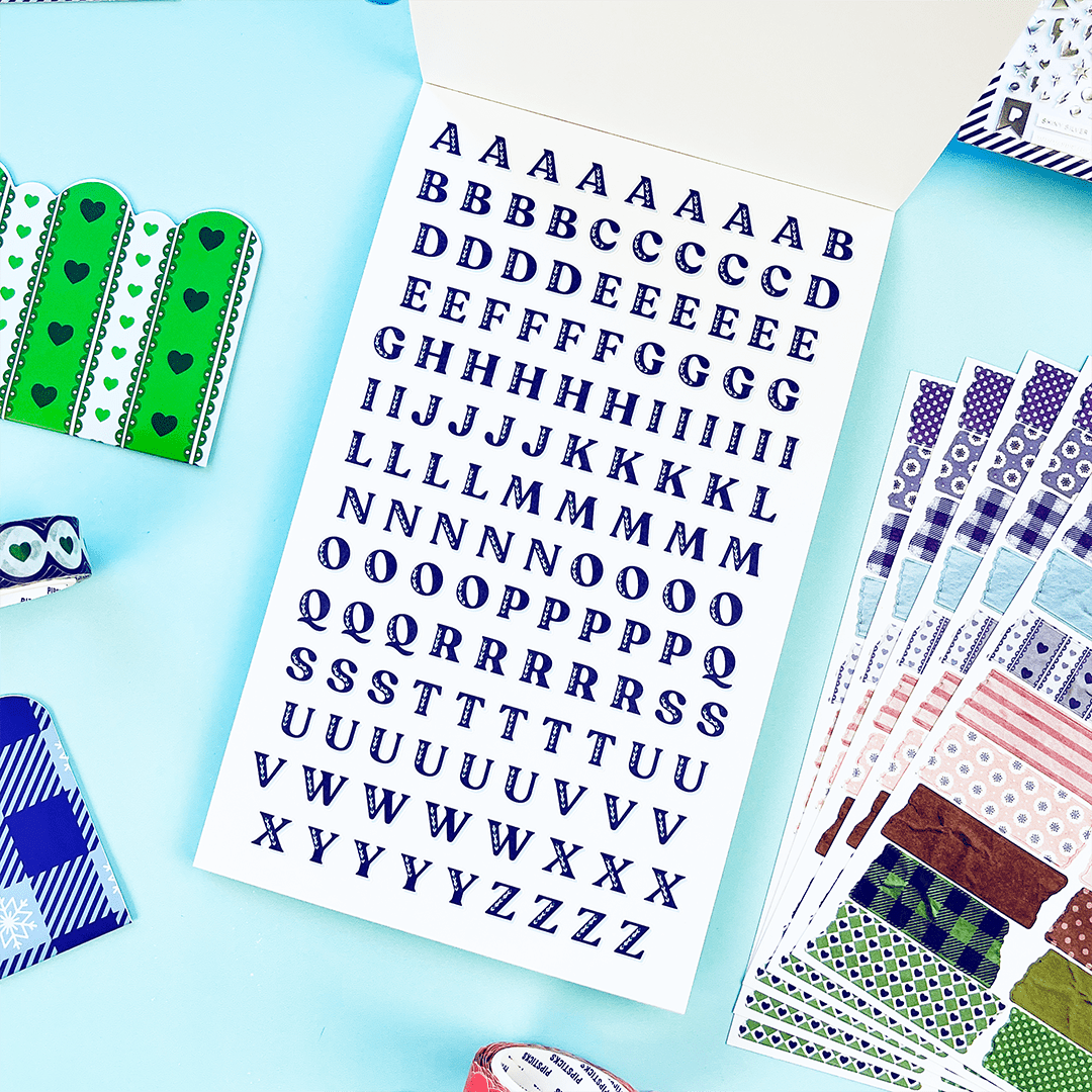 Junk journal sticker book pages with blue alphabet letter stickers
