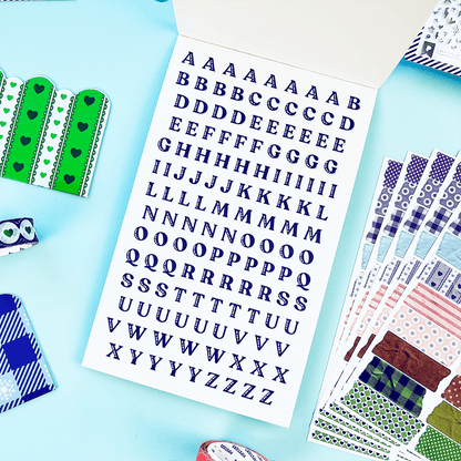 Junk journal sticker book pages with blue alphabet letter stickers