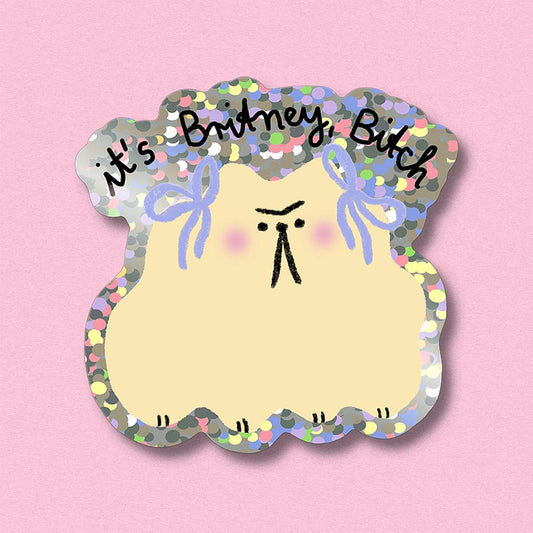 Glitter sticker, cloud-shaped yellow face with rainbow sequins, bows, and 'It's Britney Bitch' text
