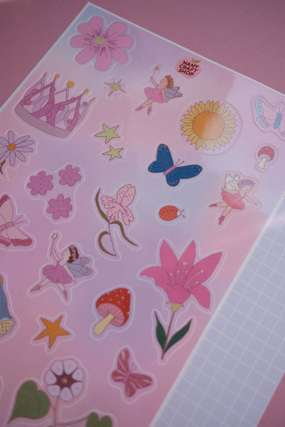 Fairy sticker sheet corner with sun, butterflies, fairies, flowers, and star stickers